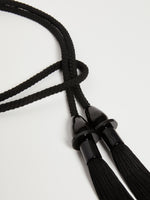 Tubular tassel belt